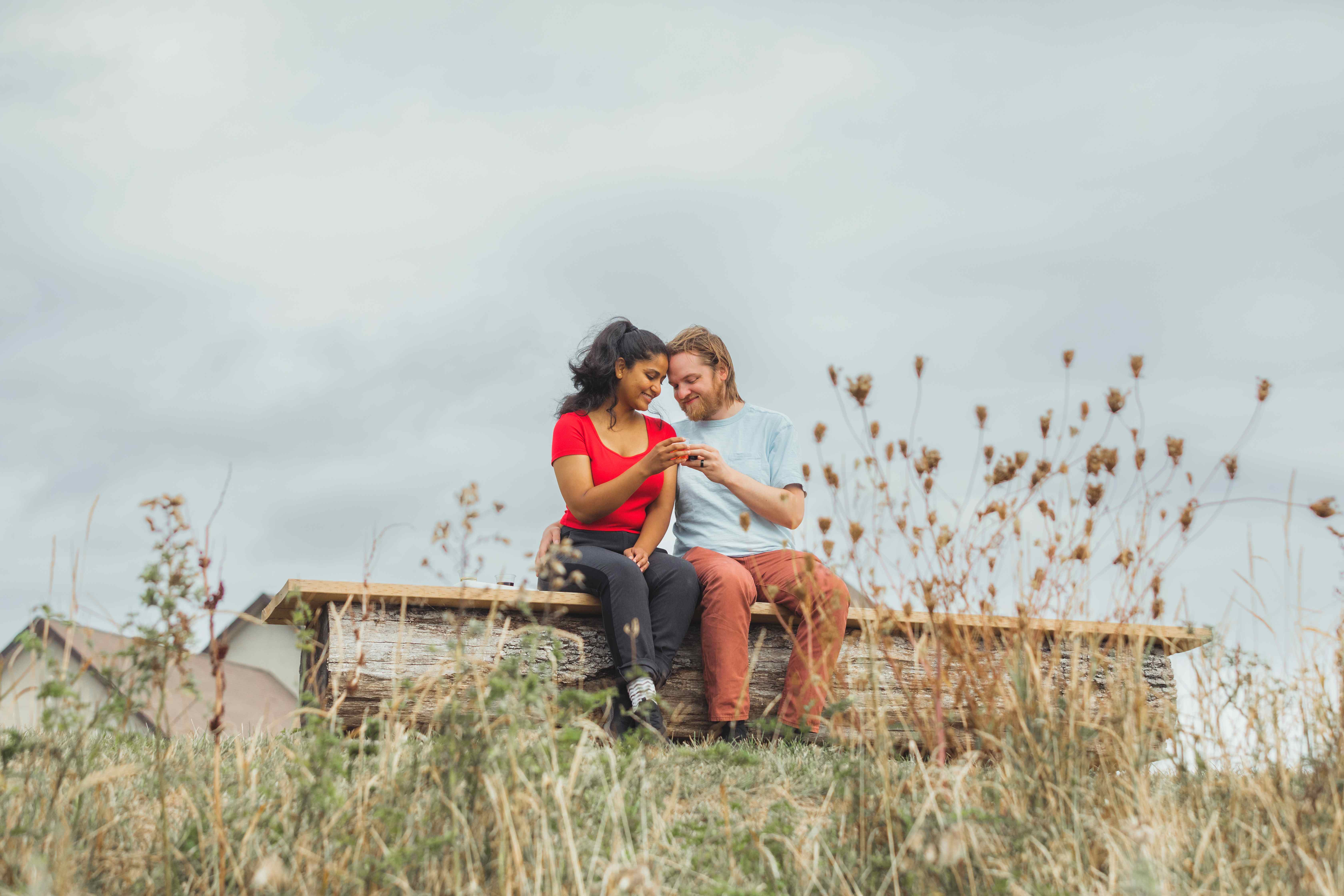 Couple clinking glasses on the shore of Lake Erie